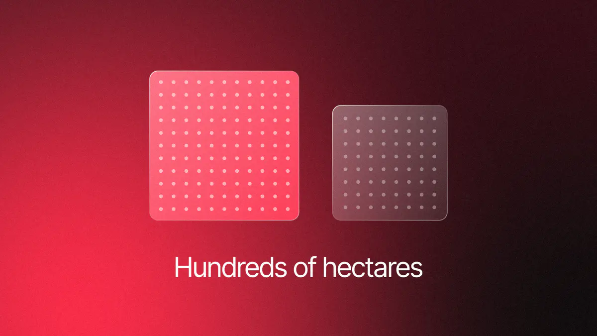 Two glass squares drawn to scale by area, a lit one for 330 hectares at Muhos and a smaller one for Kajaani, on red and black, titled Hundreds of hectares